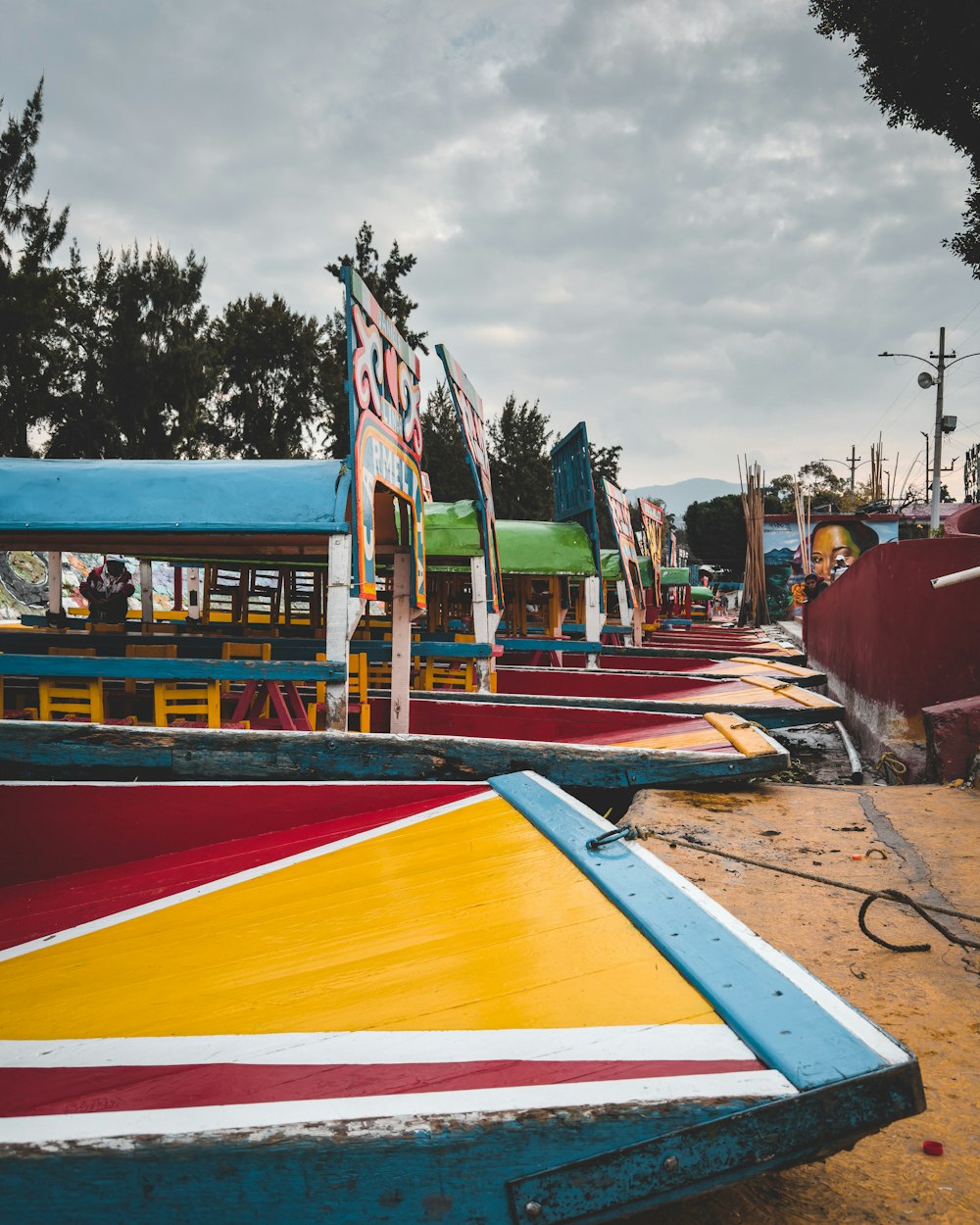 a row of colorful boats sitting next to each other