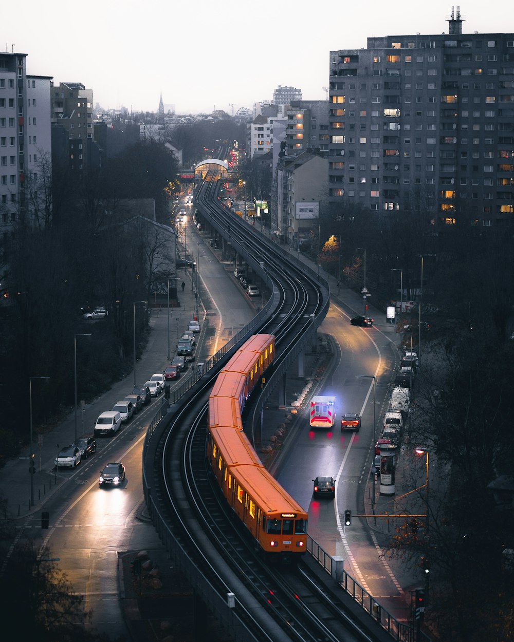 a train on a train track in a city