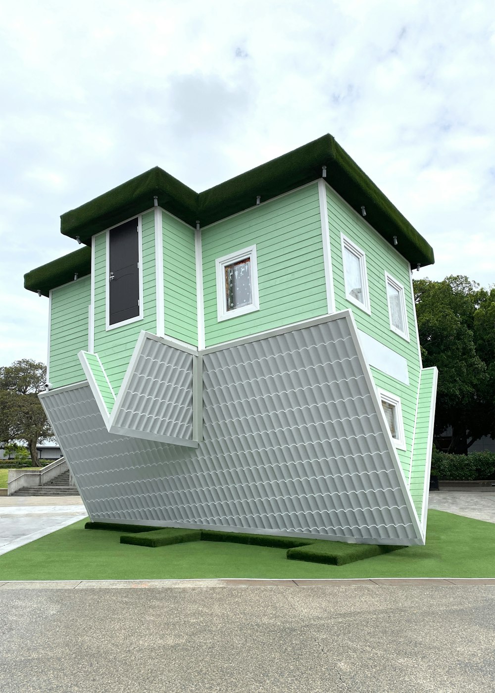 a house that is upside down on the ground