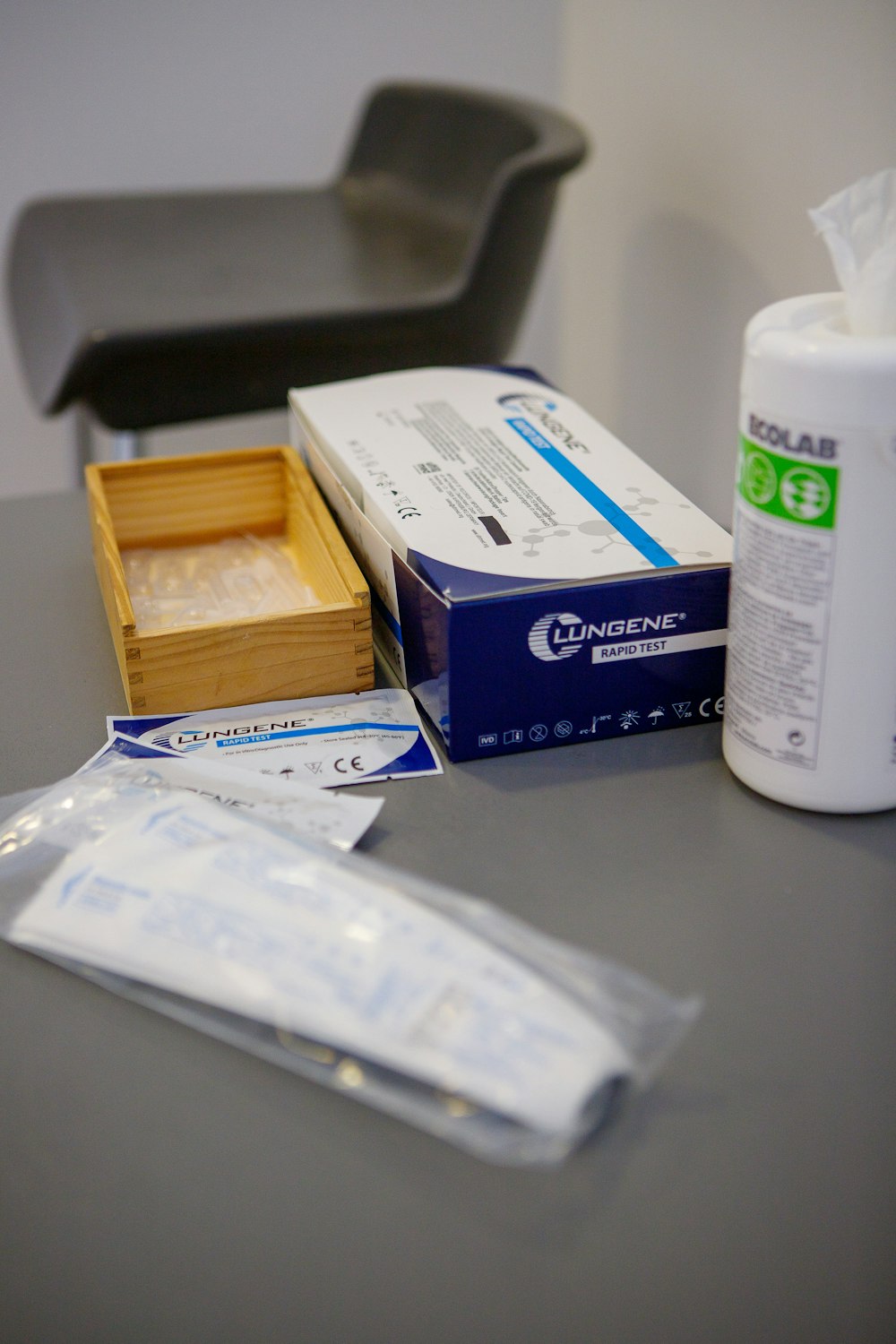 a table with a box of medicine and a box of tissues
