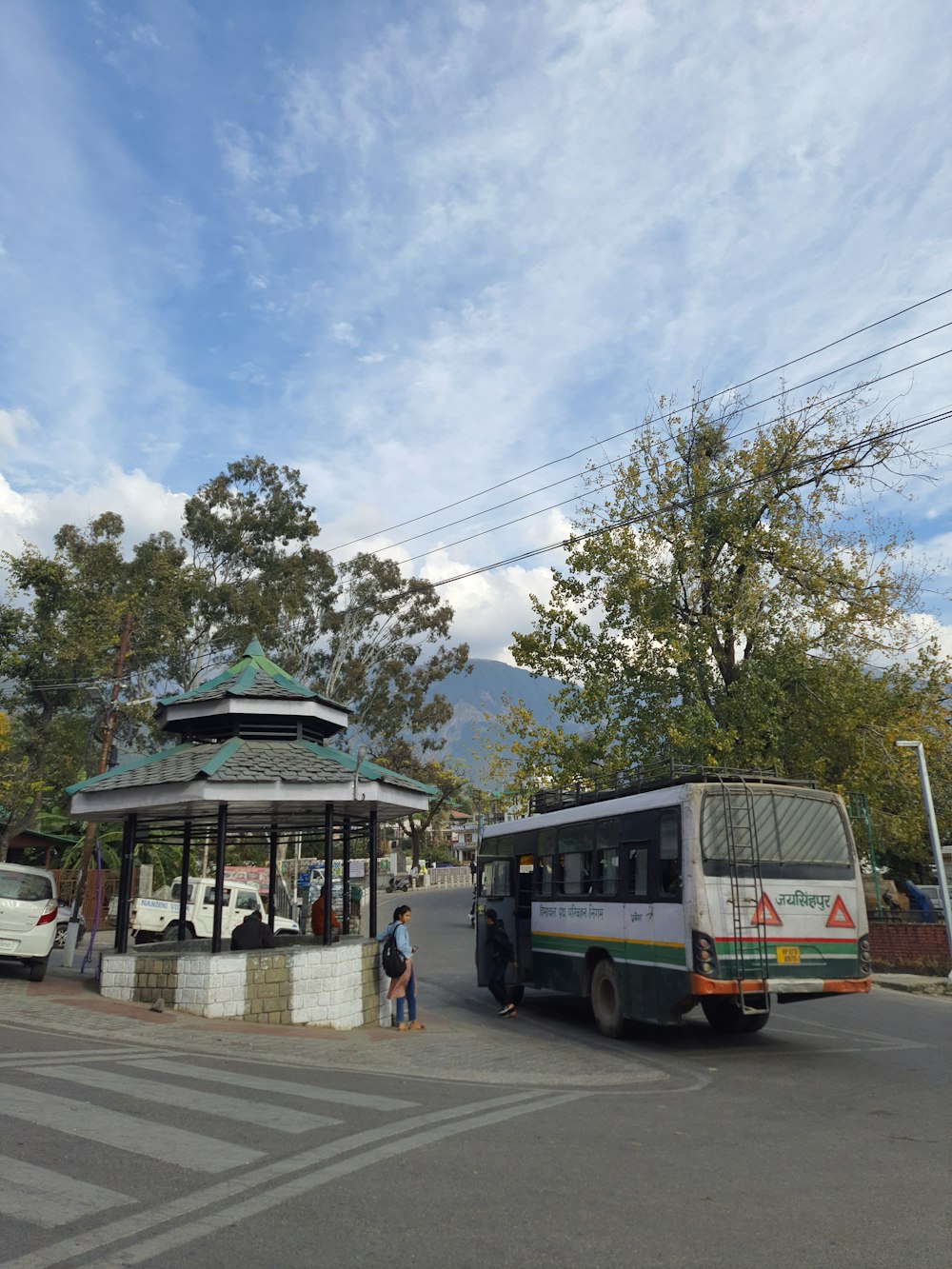 a bus and a bus stop on a street