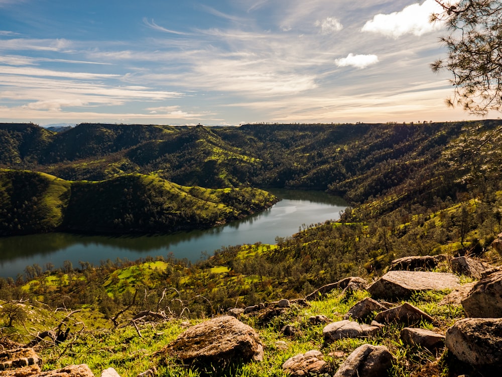 a view of a lake in the middle of a mountain range