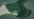 a green and white abstract background with wavy shapes