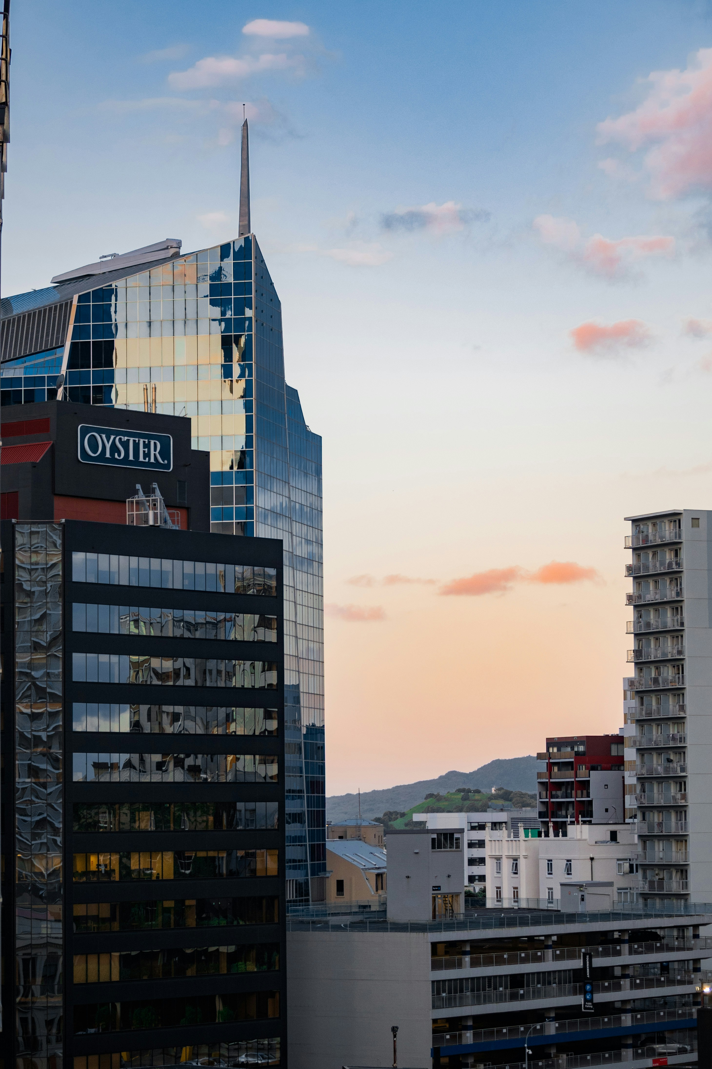 a tall building with a sky scraper in the background