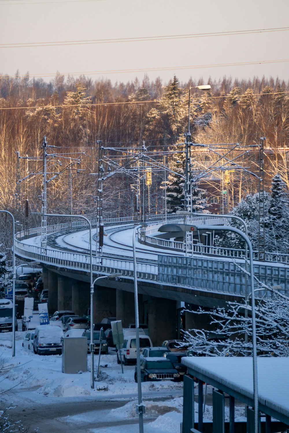 a train traveling over a snow covered bridge