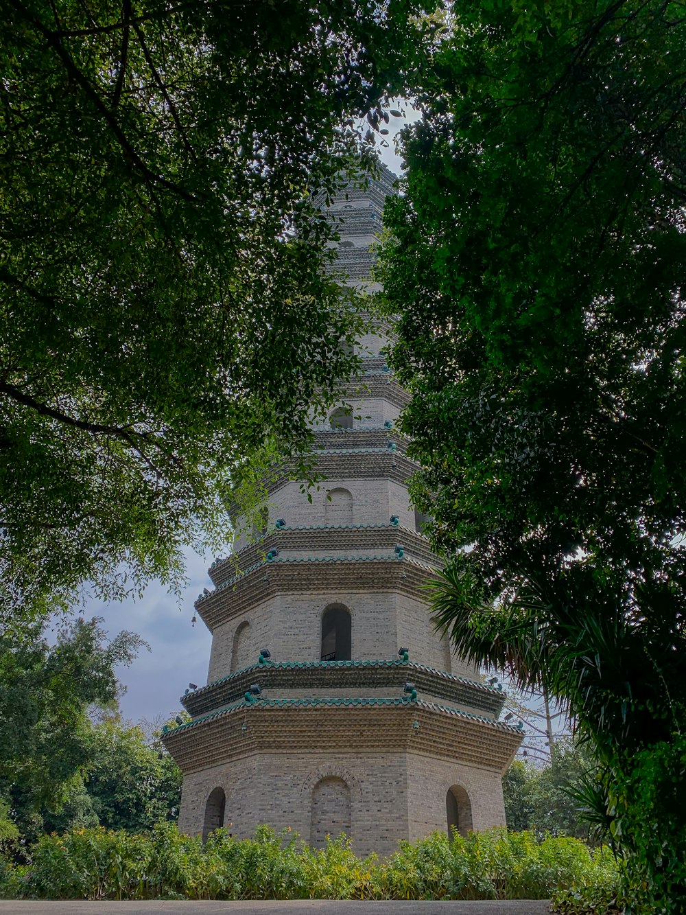 a tall tower with a clock on the top of it