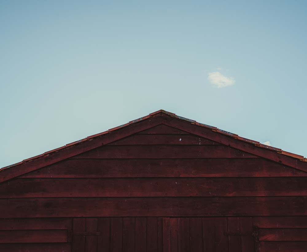 a red barn with a sky background