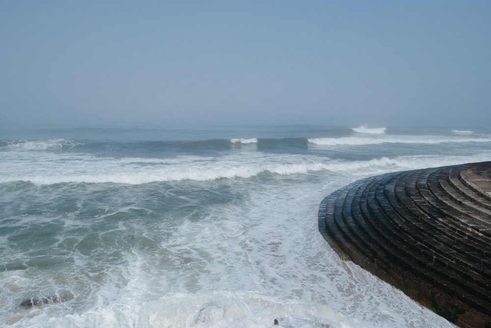 a large body of water with waves coming in to shore