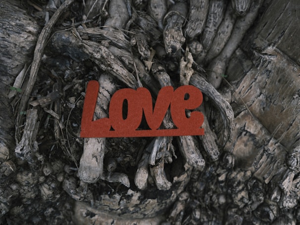 An ethereal image of roots intertwined with small glowing hearts, symbolizing inner growth.