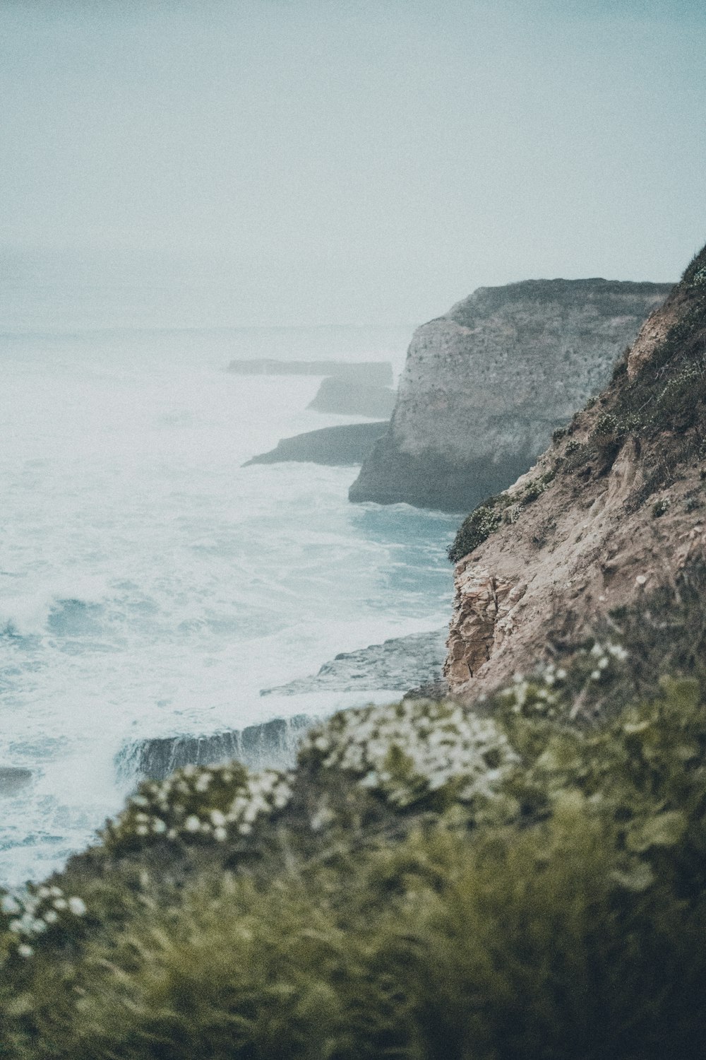 a view of the ocean from a cliff