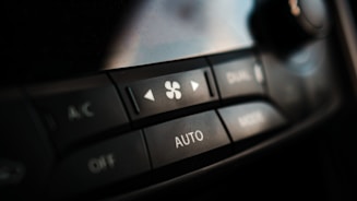 Modern car dashboard showing air conditioning controls