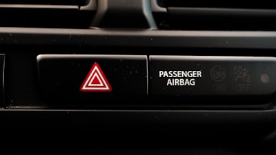 Close-up of vehicle dashboard showing SRS block with crash data being reset on a diagnostic tool.