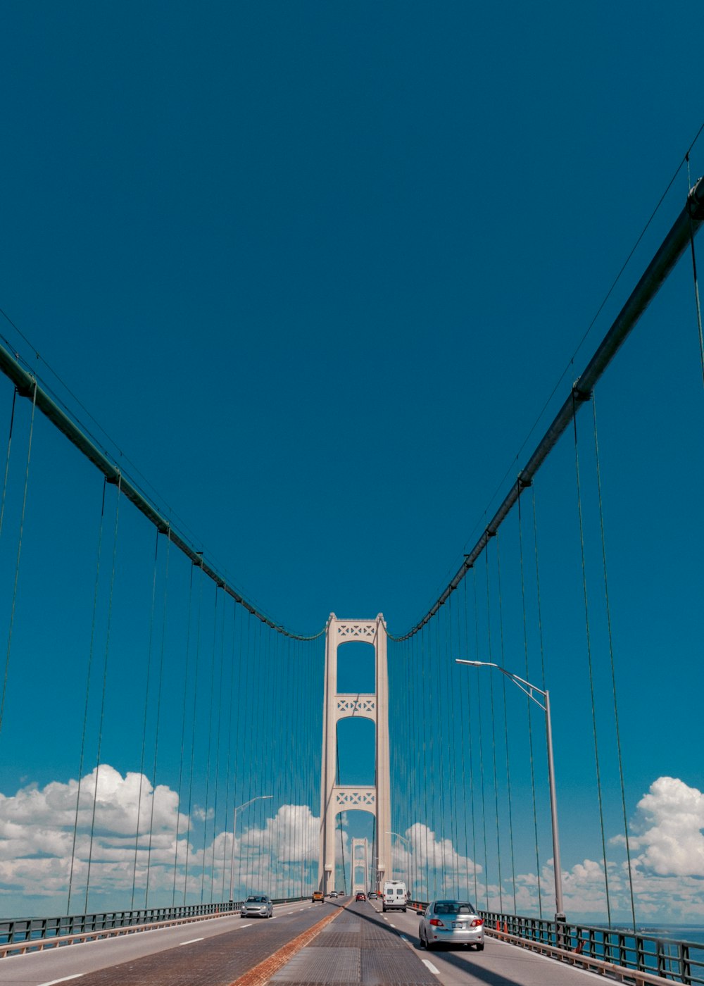 a view of a bridge from a car on the road