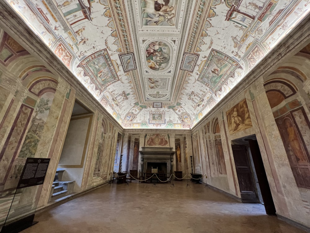 a large room with a ceiling painted with paintings