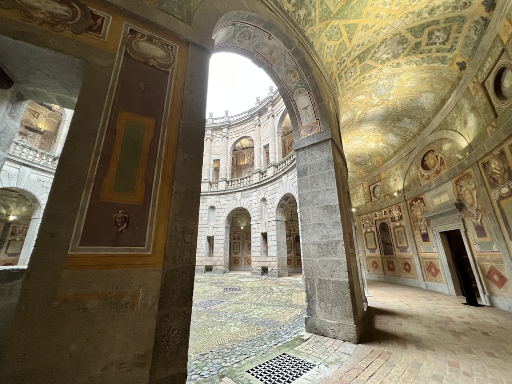 a large room with a ceiling painted in gold and silver