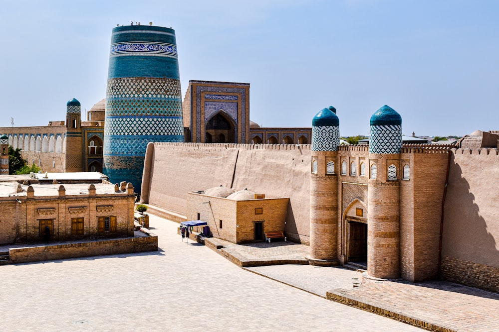 a large building with a tall tower in the background