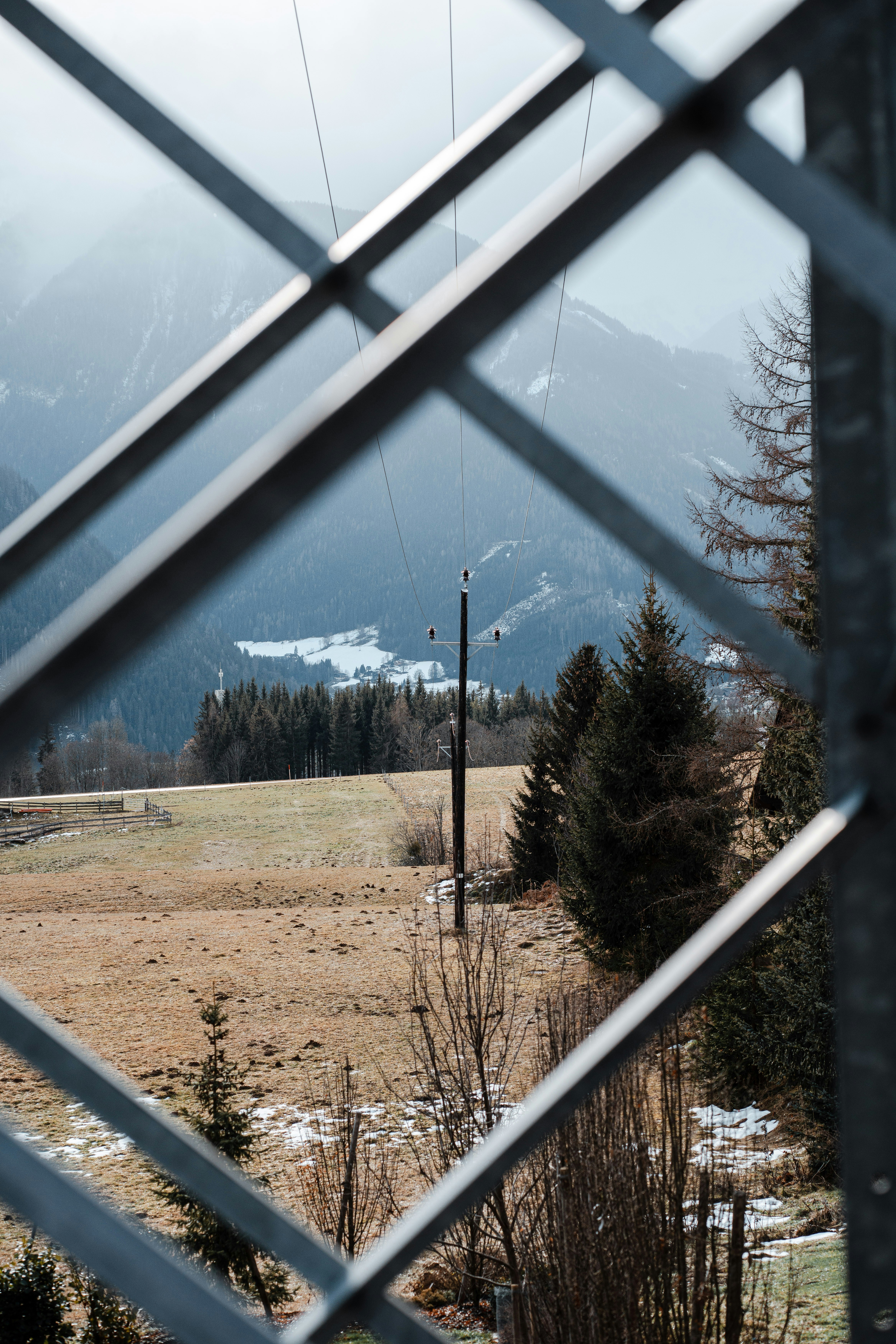 a view of a field through a fence