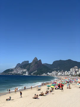 Traveler relaxing on a vibrant beach in Rio de Janeiro with iconic cityscape behind.