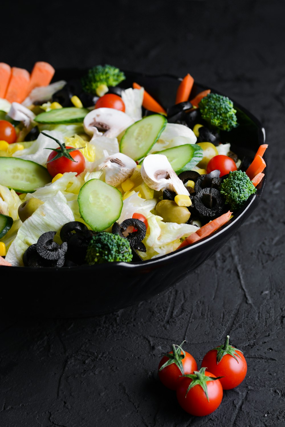 a bowl filled with vegetables on top of a table