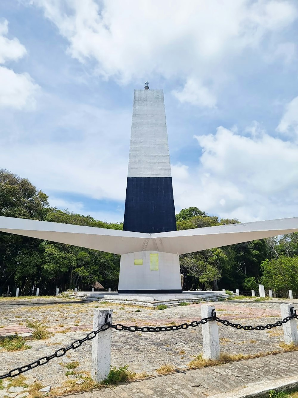 a monument with a chain in front of it