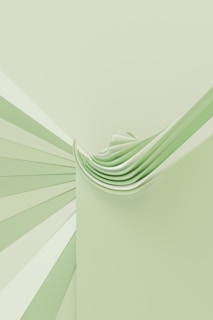 a green and white wall with a stack of folded papers