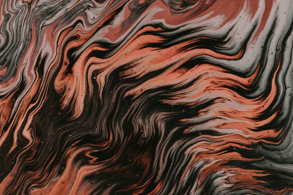 a close up of a red and black marble