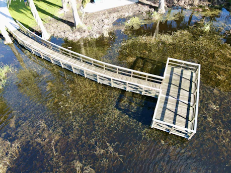 a wooden bridge over a body of water