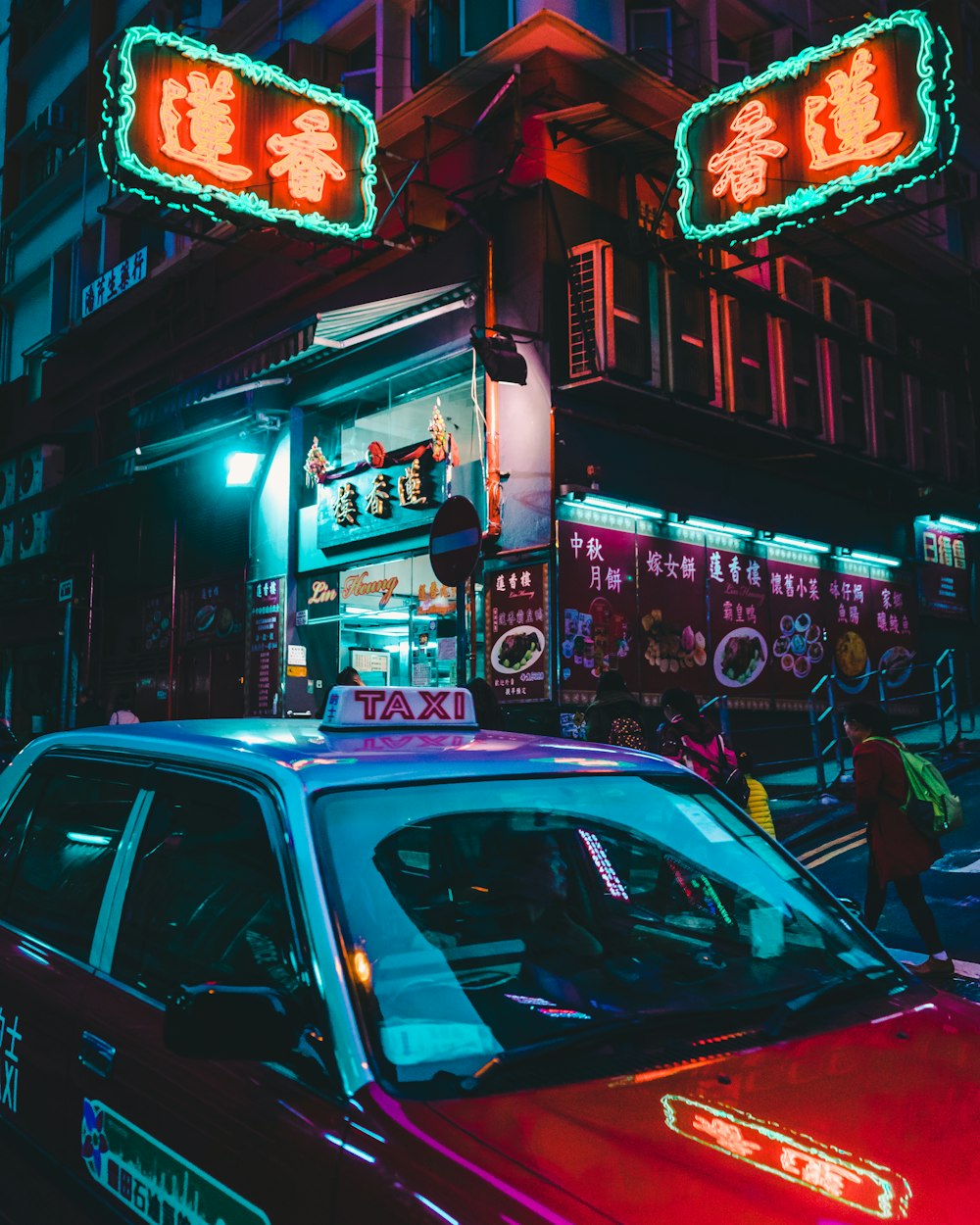 a taxi cab is parked in front of a chinese restaurant