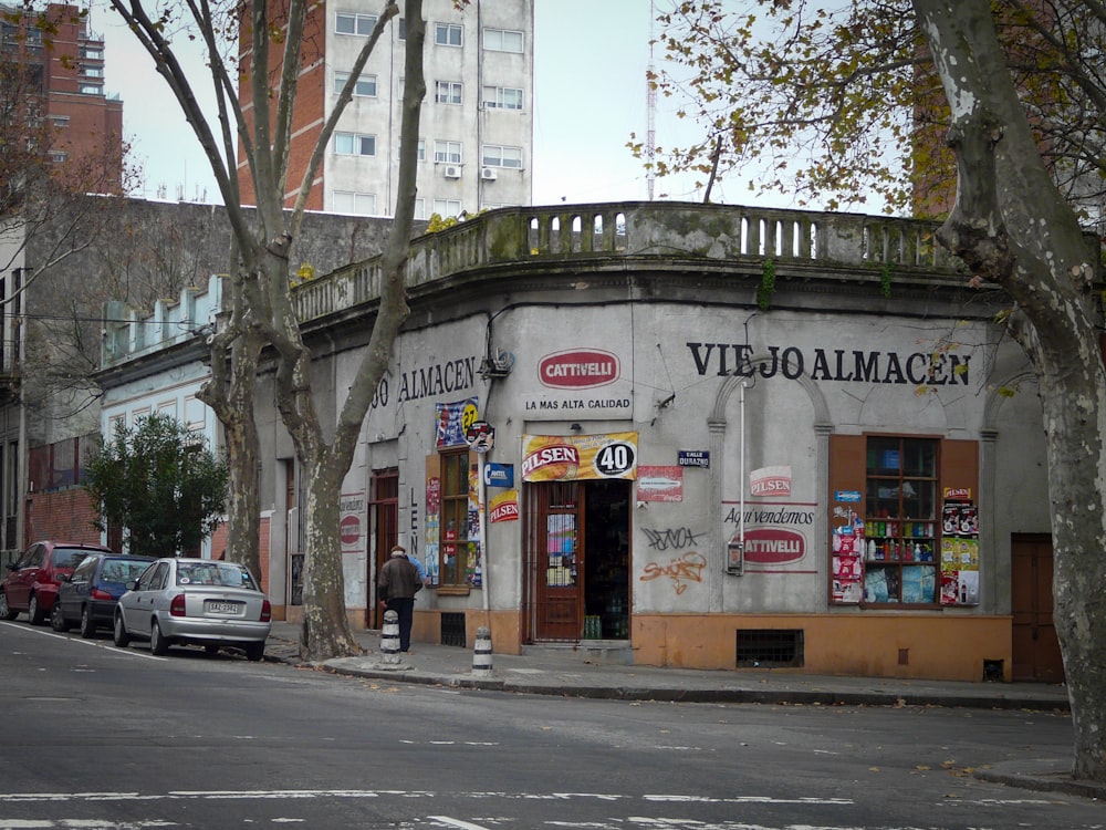 a street corner with cars parked on the side of the road