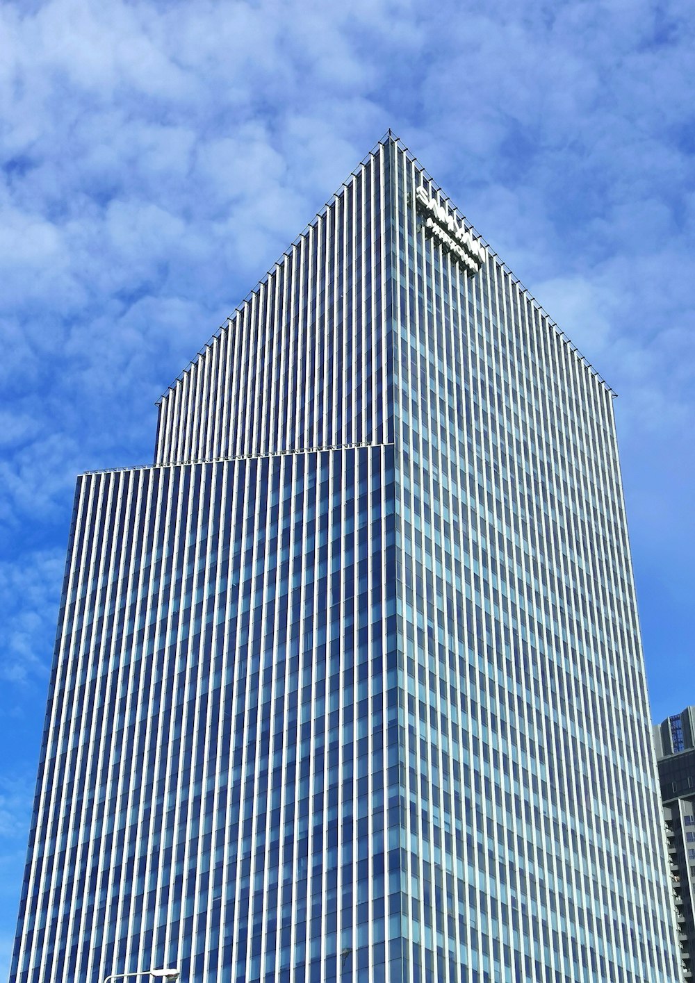 a very tall building with a clock on it's side