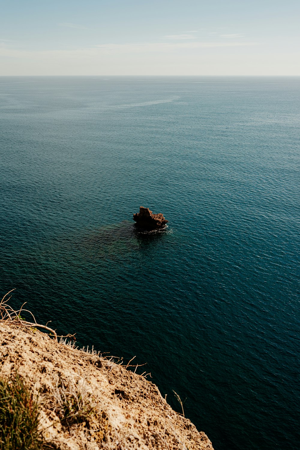 a boat floating on top of a large body of water