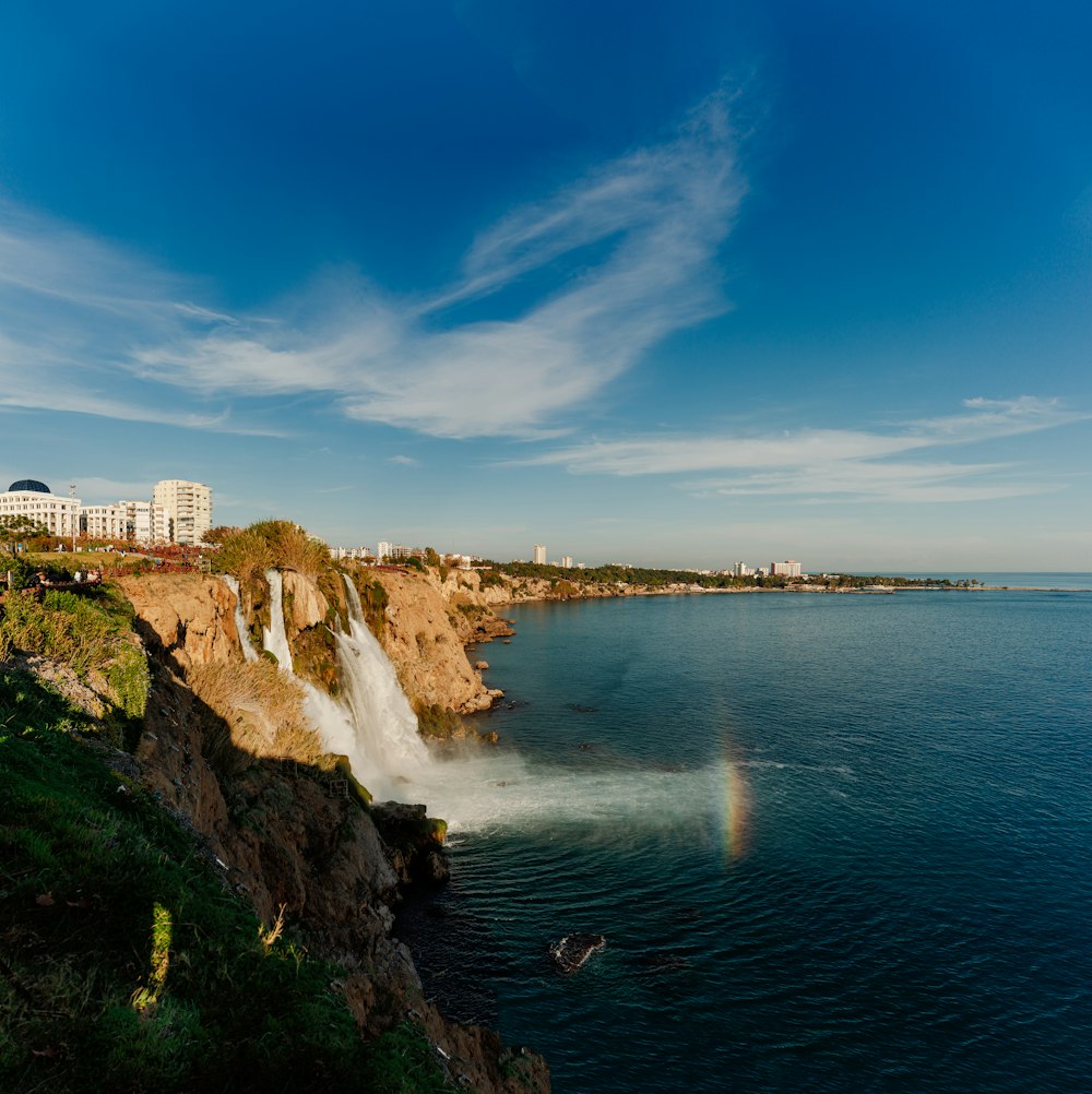 a large waterfall is coming out of the water