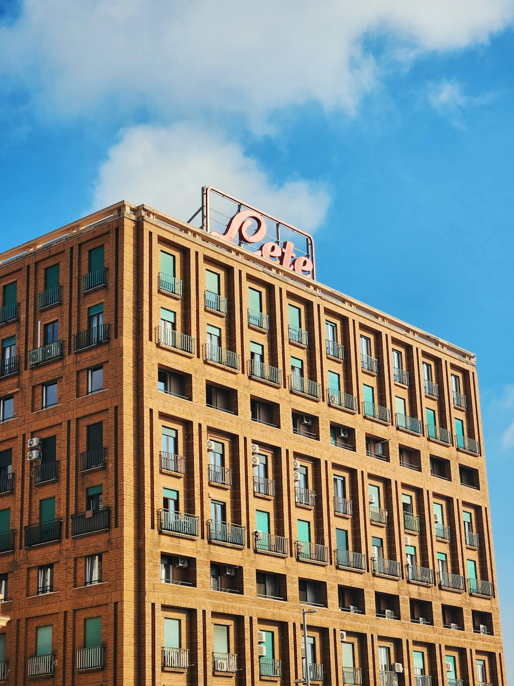 a tall building with a sign on top of it