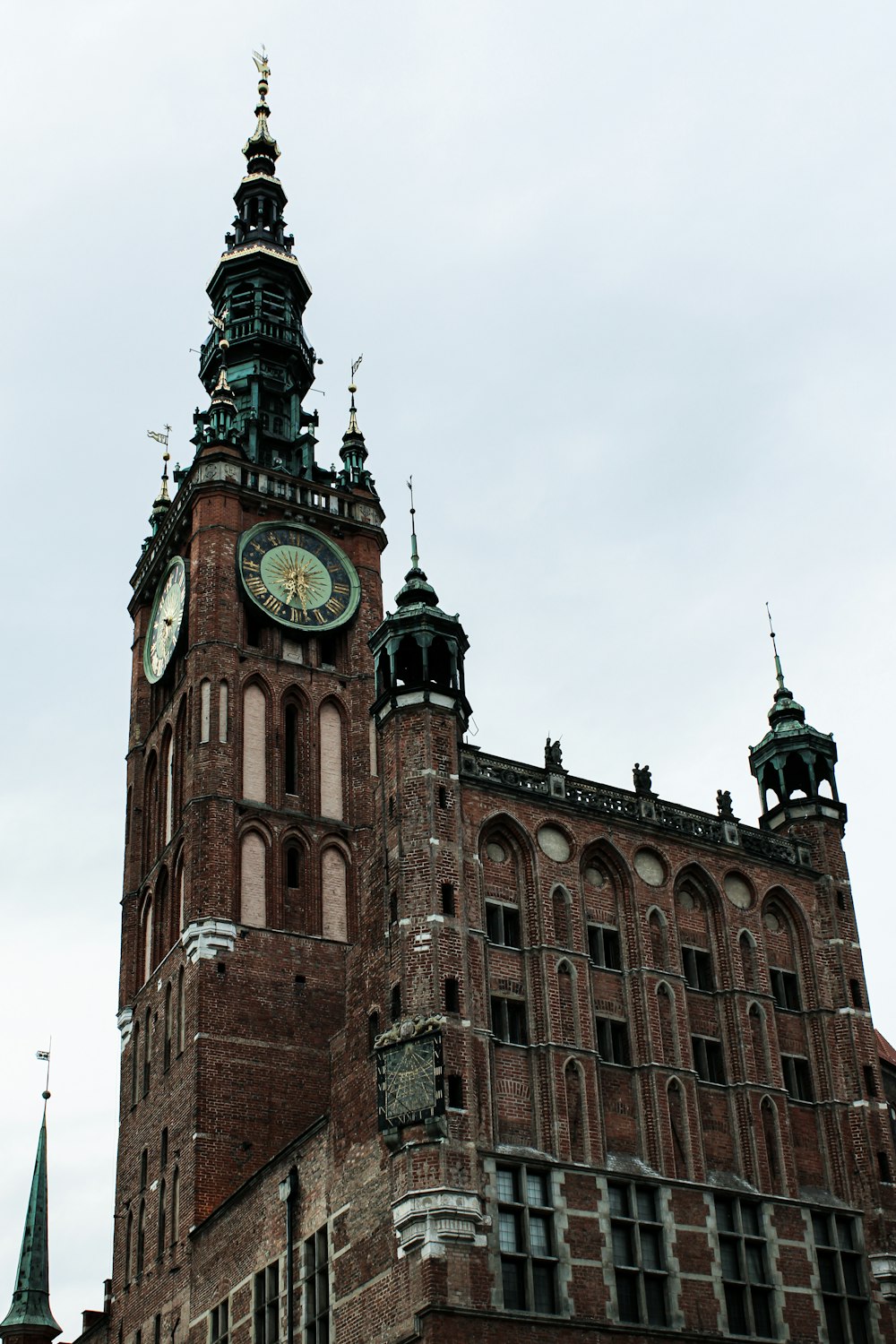 a very tall building with a clock on it's side