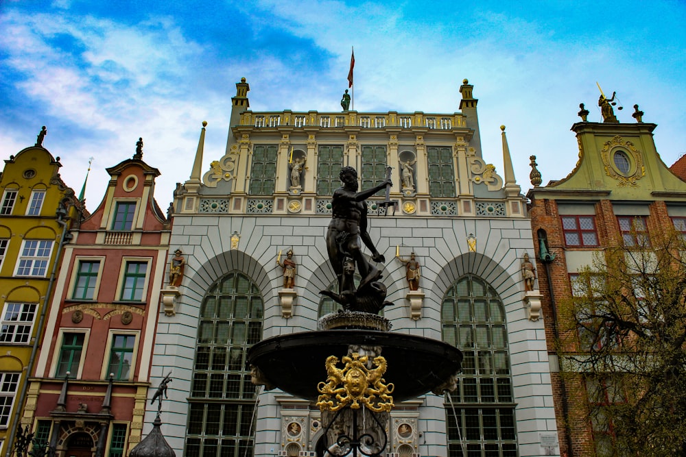 a fountain in front of a large building