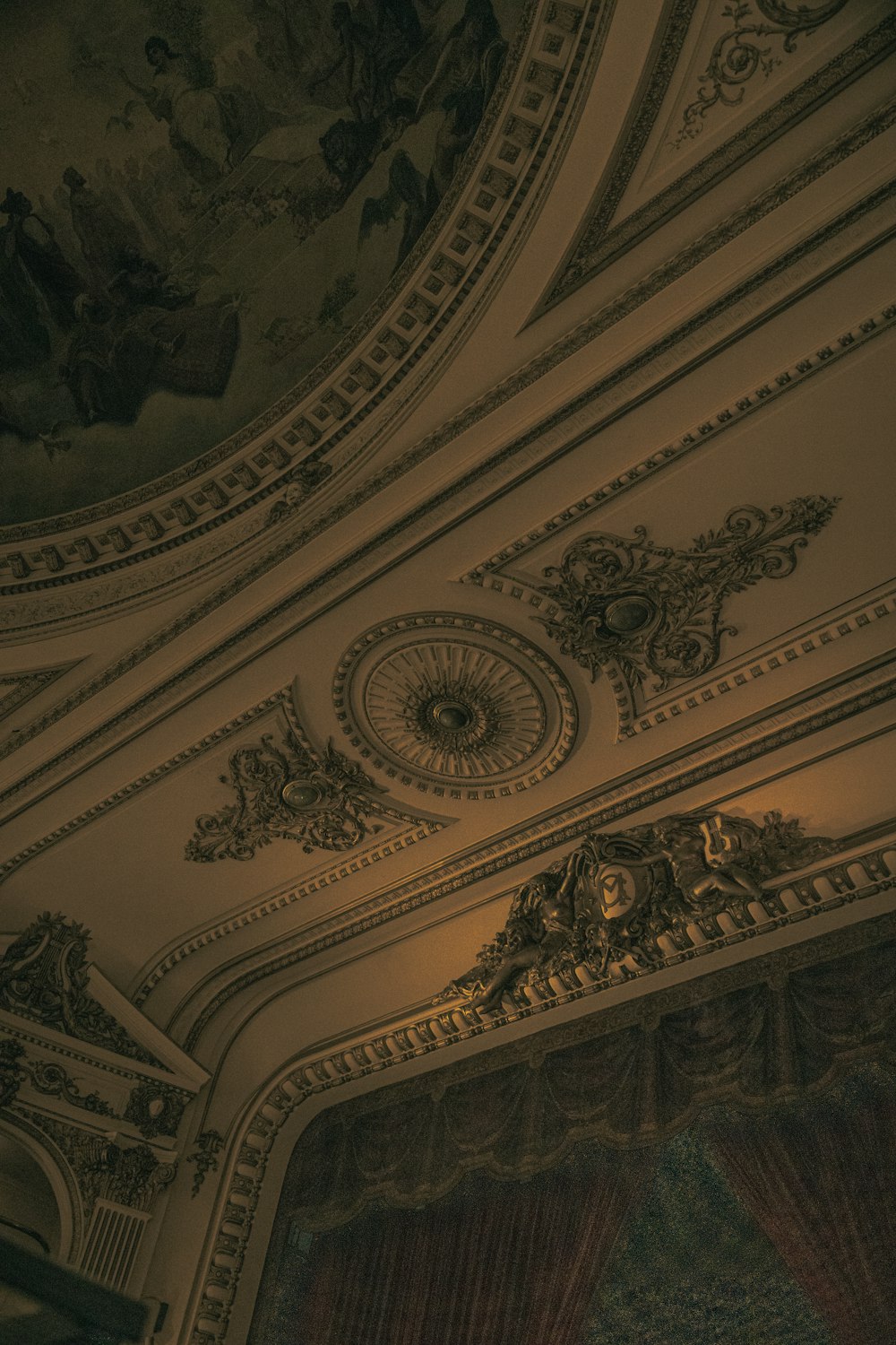 an ornately decorated ceiling in a theater