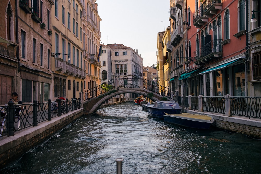 a river running through a city next to tall buildings