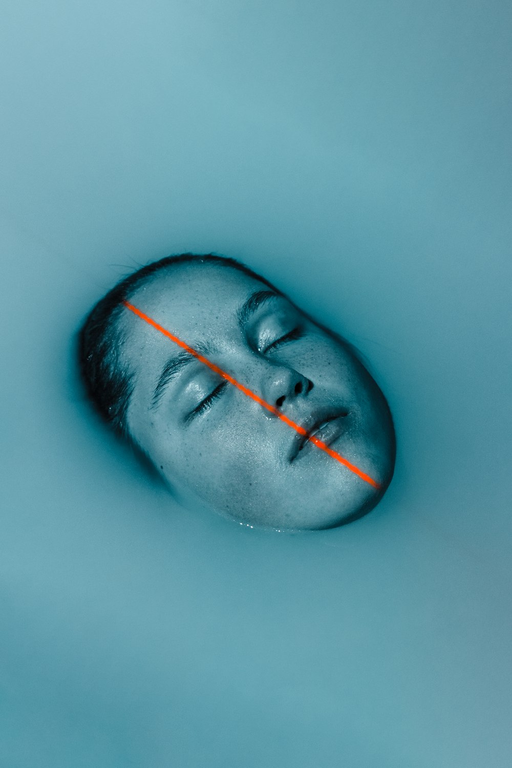 a man is floating in a pool of water