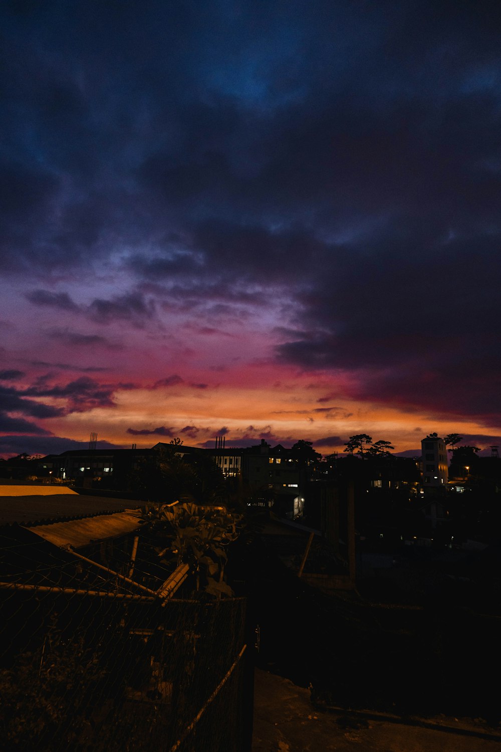 a purple and blue sky with a few clouds