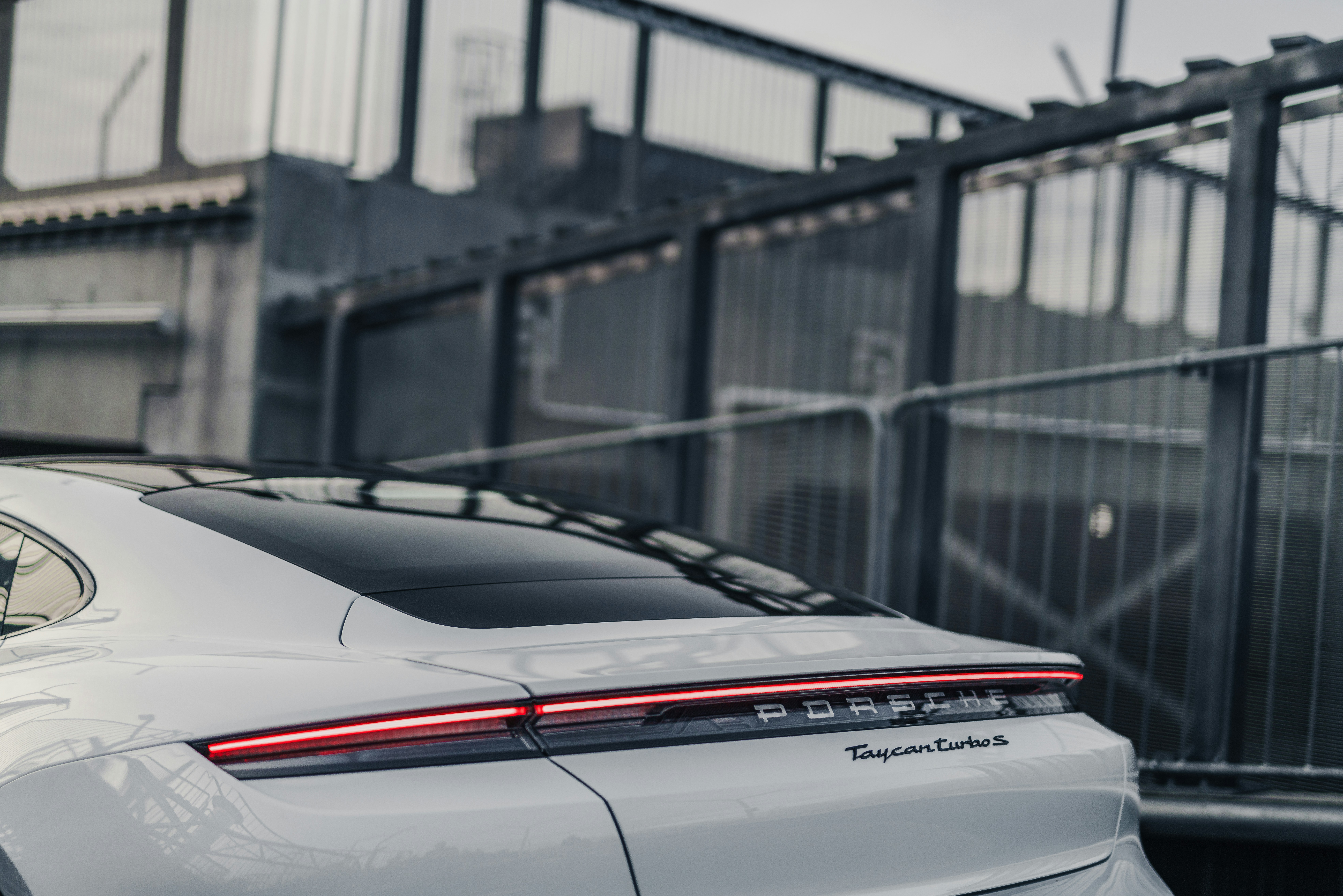 a white car parked in front of a building