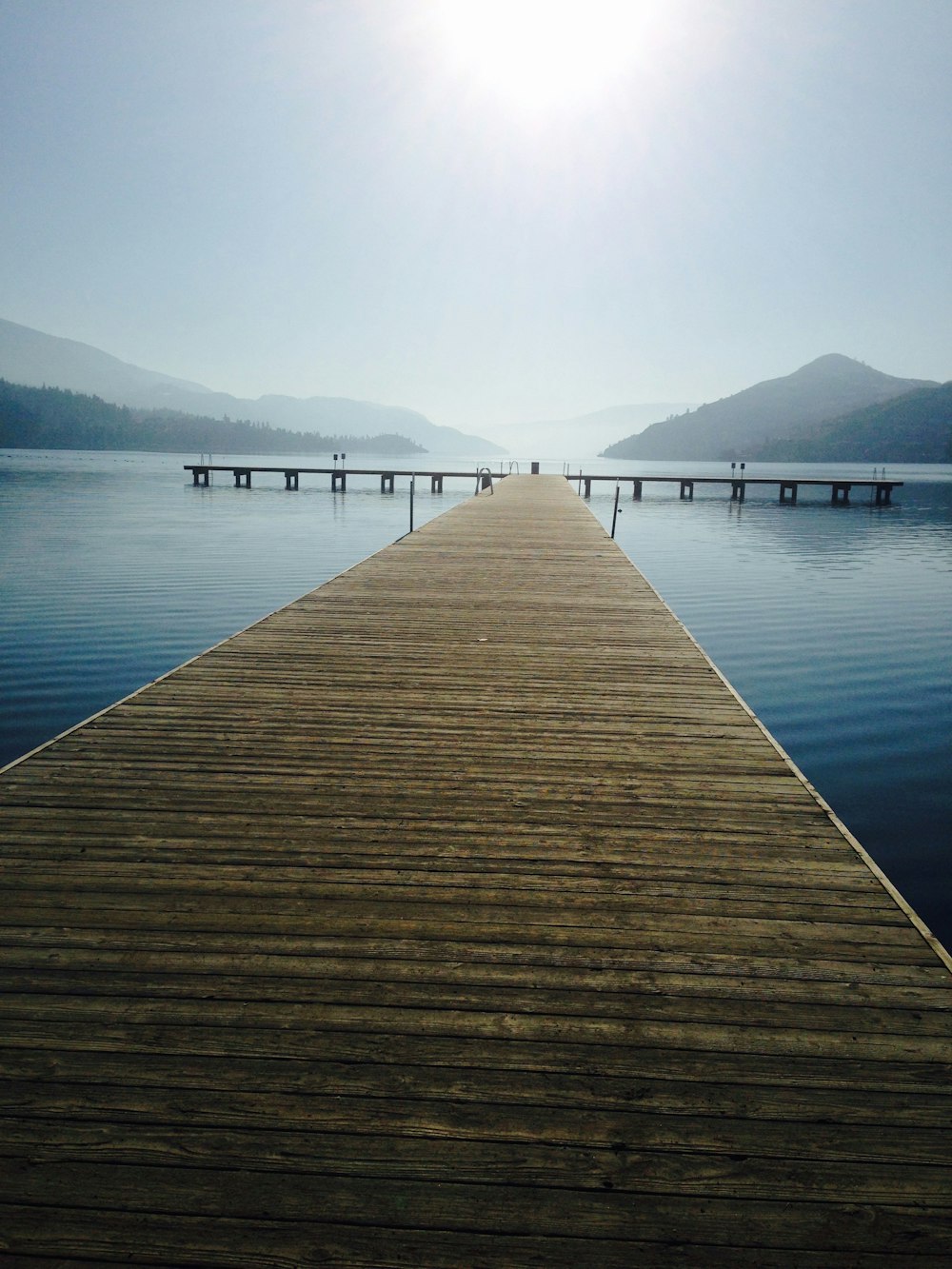 a wooden dock sitting on top of a body of water