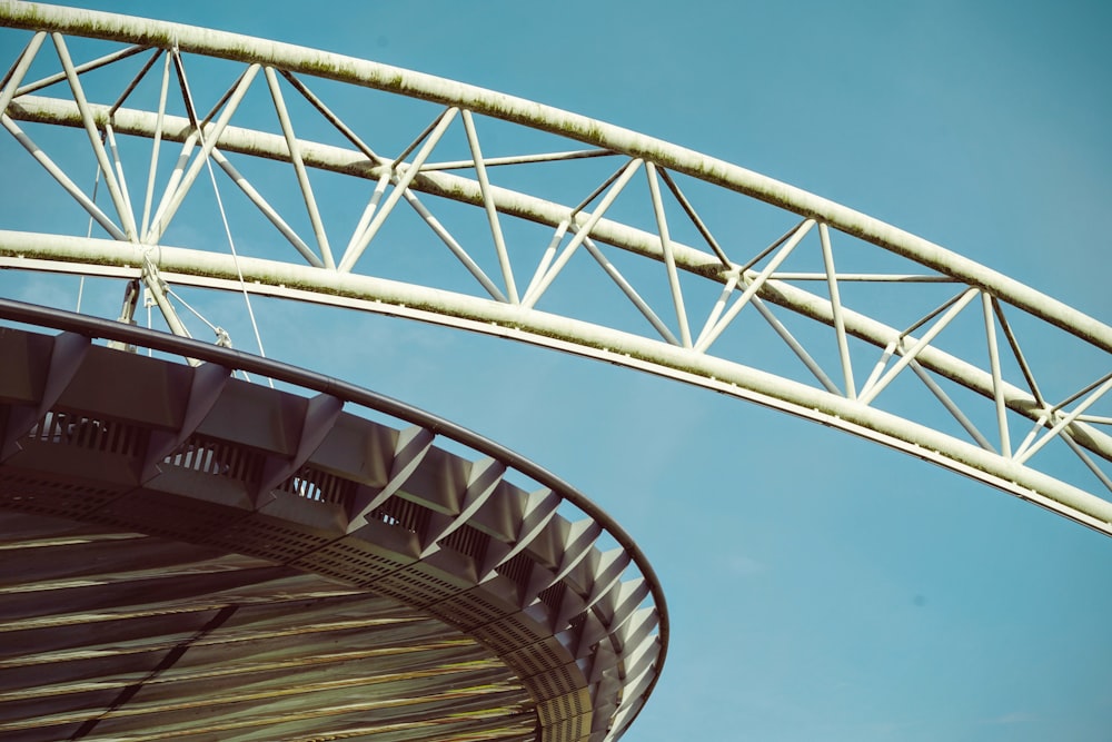 a close up of a bridge with a blue sky in the background