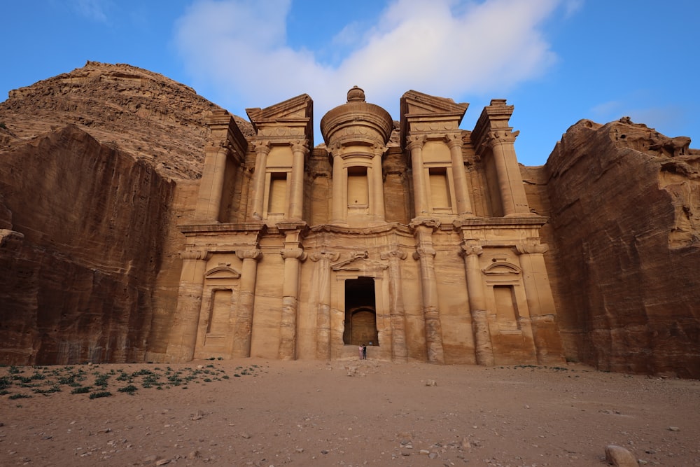 a large stone building with a door in the middle of it