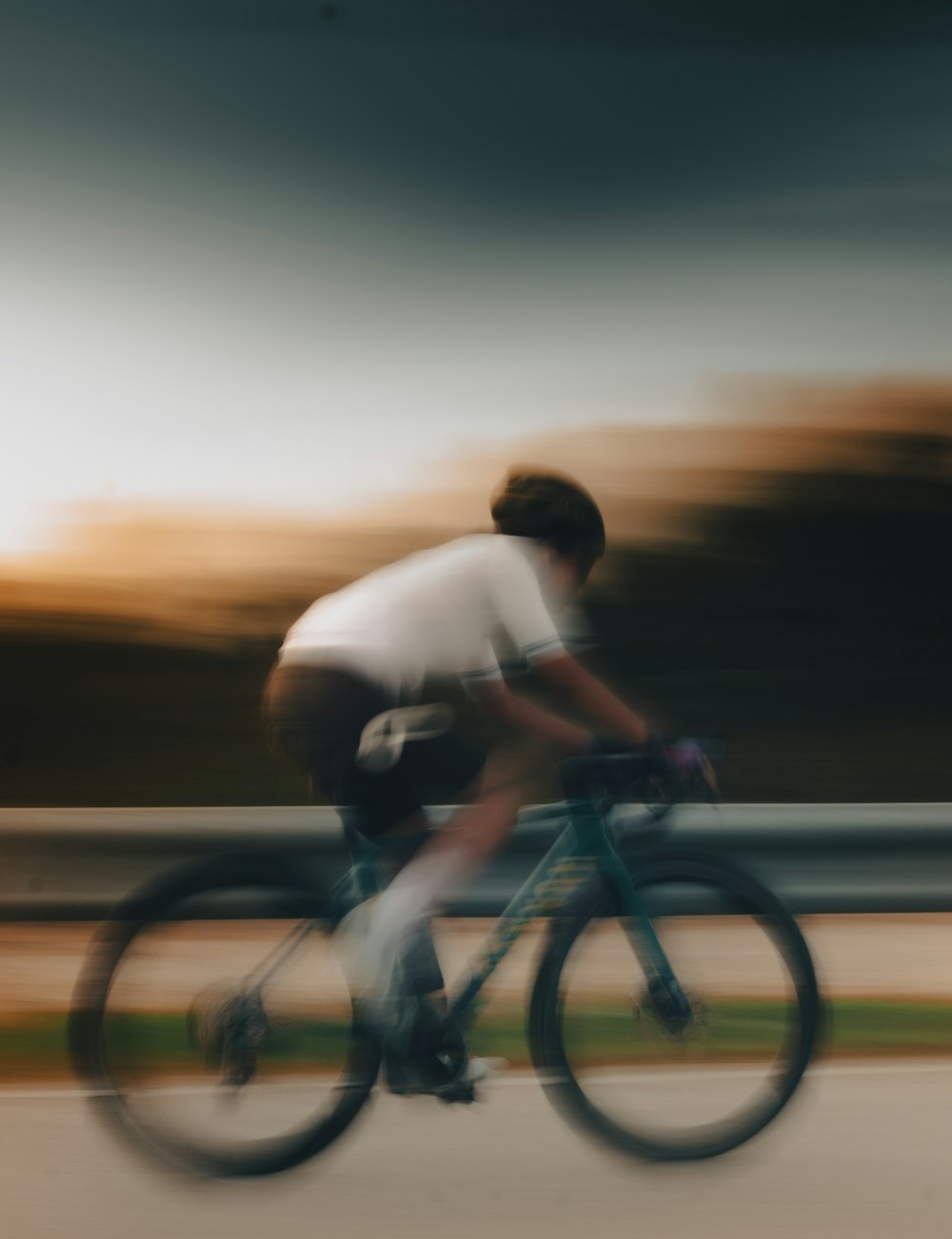 a blurry photo of a man riding a bike