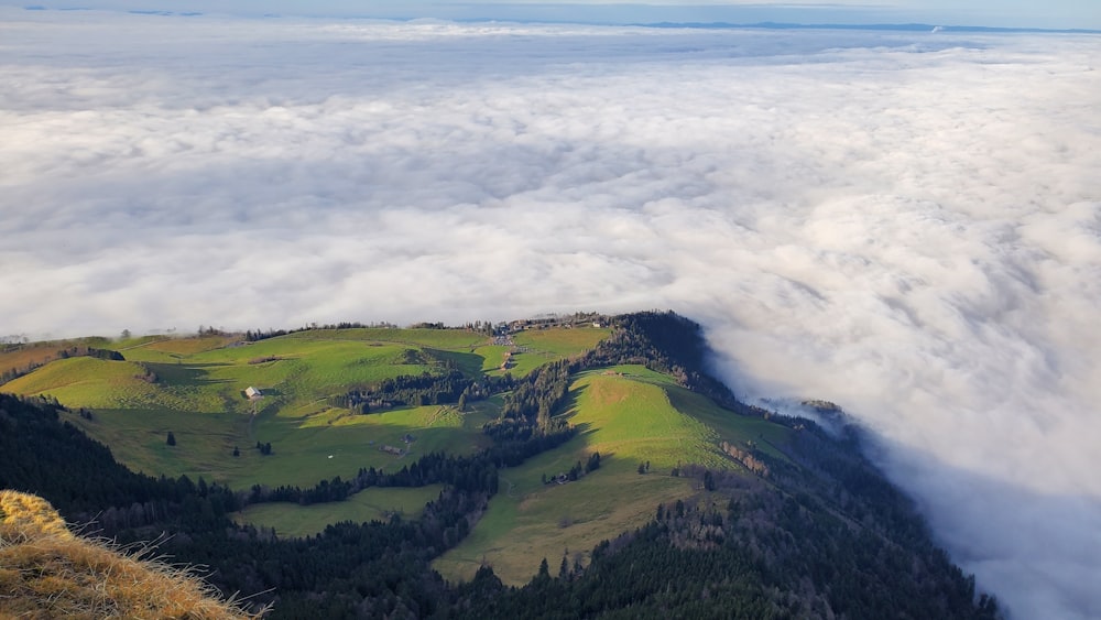 a view of a mountain covered in clouds