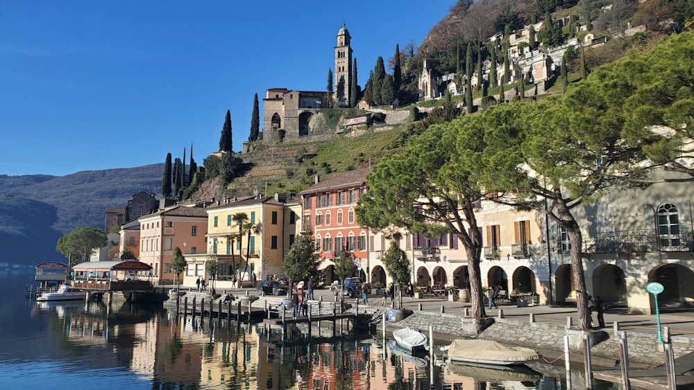 a row of buildings next to a body of water