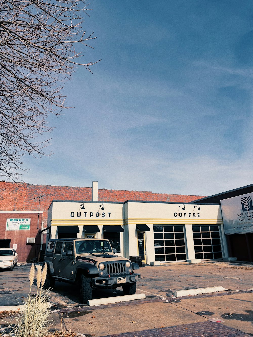 a jeep is parked in front of a building