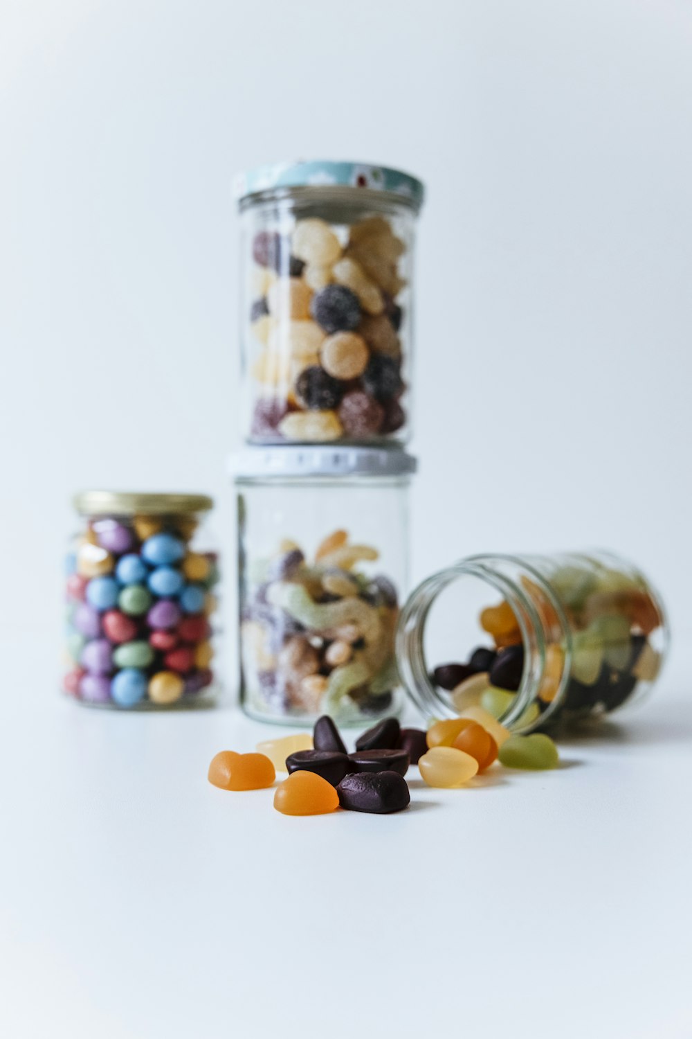 a jar filled with lots of different colored candies