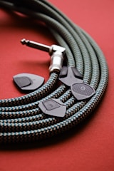 a close up of a cord on a red surface