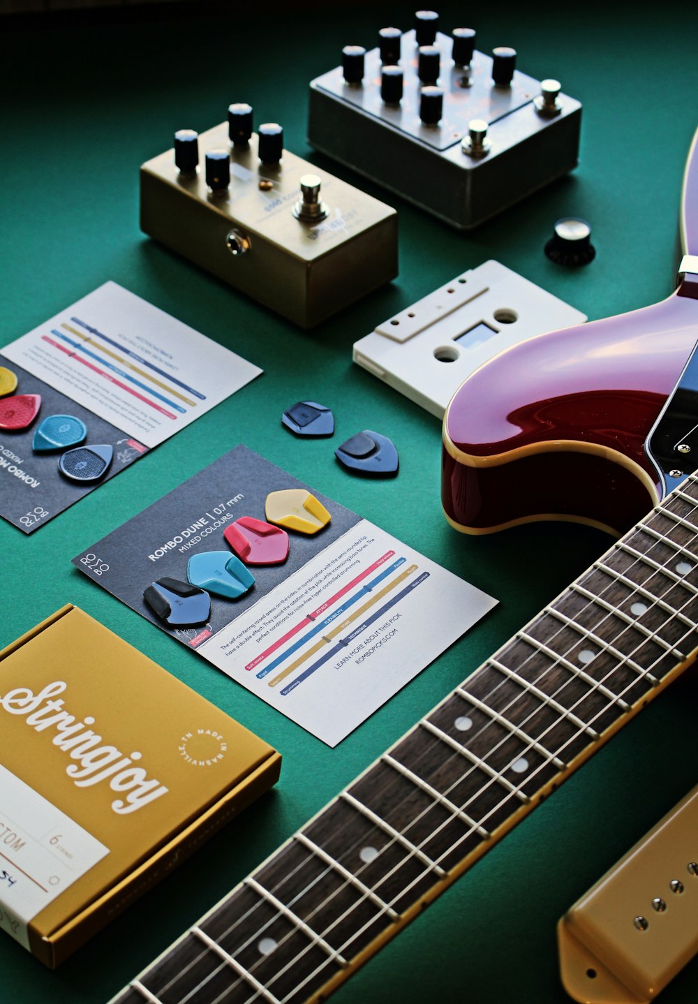 a guitar and other musical instruments on a table